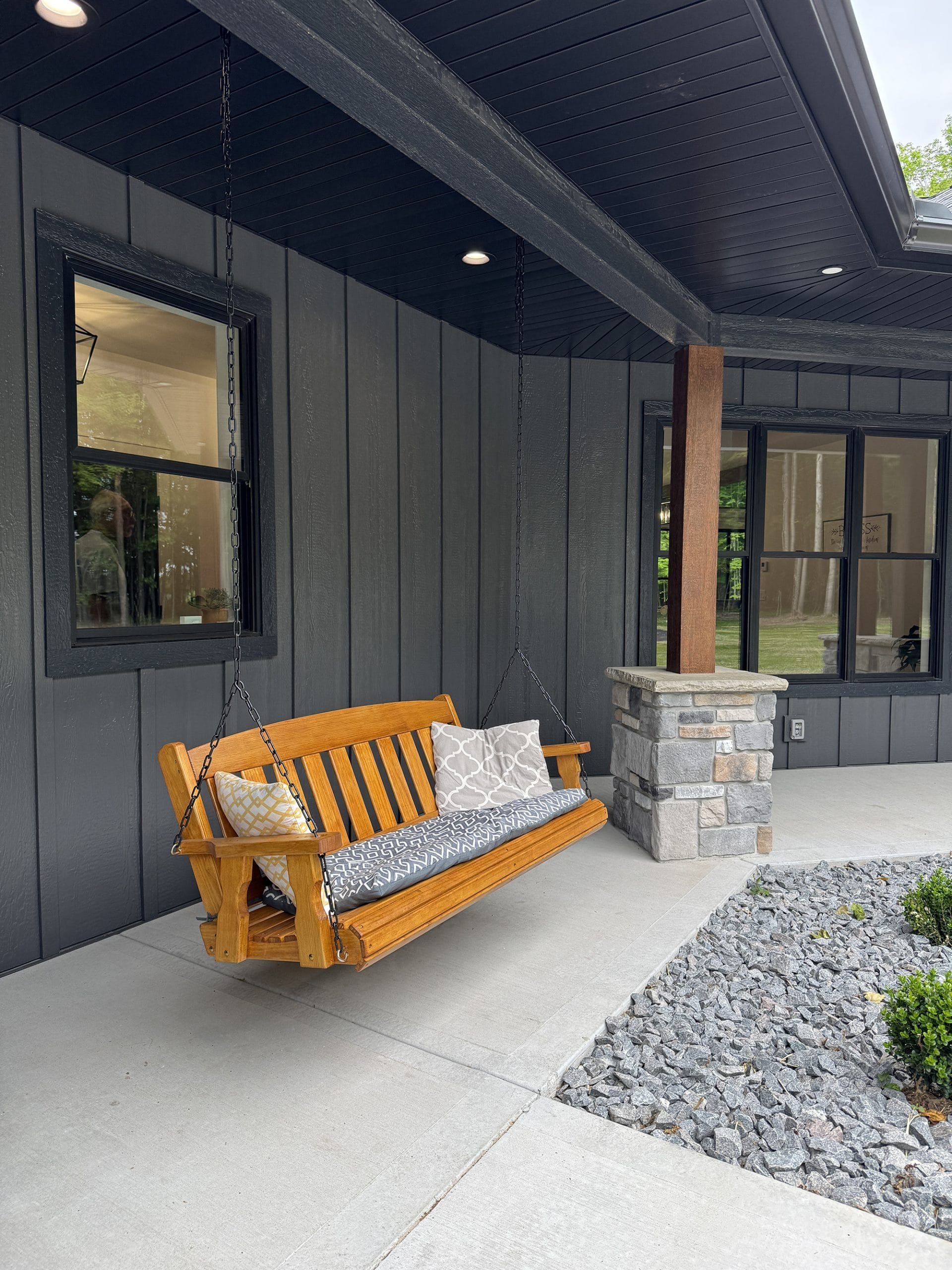 Front porch design with vertical board and batten siding in Smoky Ash